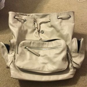 Cream colored leather backpack